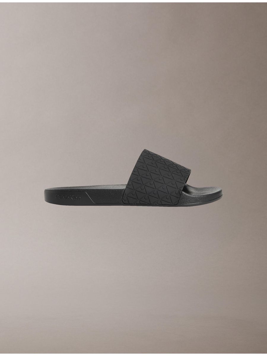sandalias-slide-aop-calvin-klein-hombre-gris-oscuro-hm0hm02110-0gt